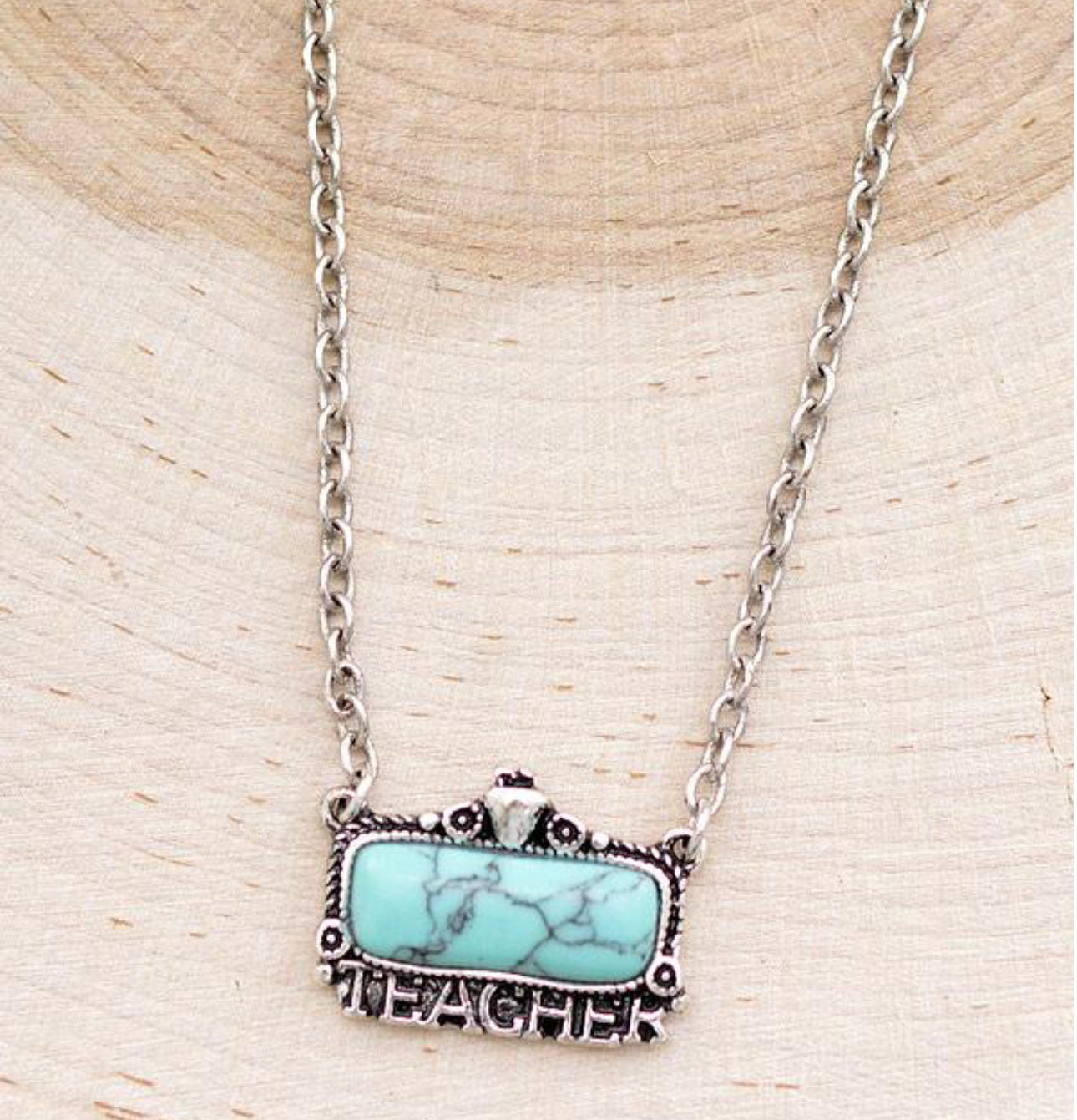 Turquoise Teacher Pendant Necklace
Approx: 18"
Lobster claw closure with extending hooks